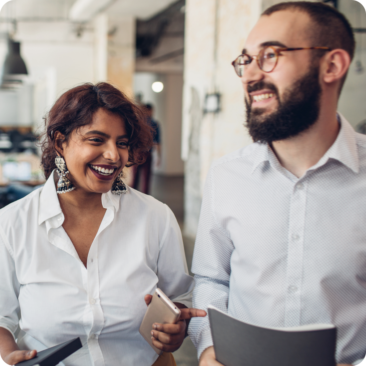 a man and a woman are standing next to each other and smiling